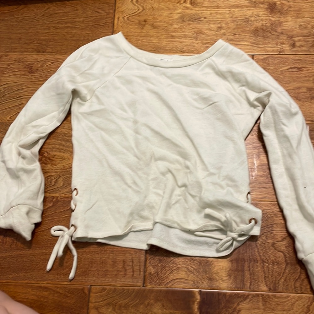 white and gold sweater